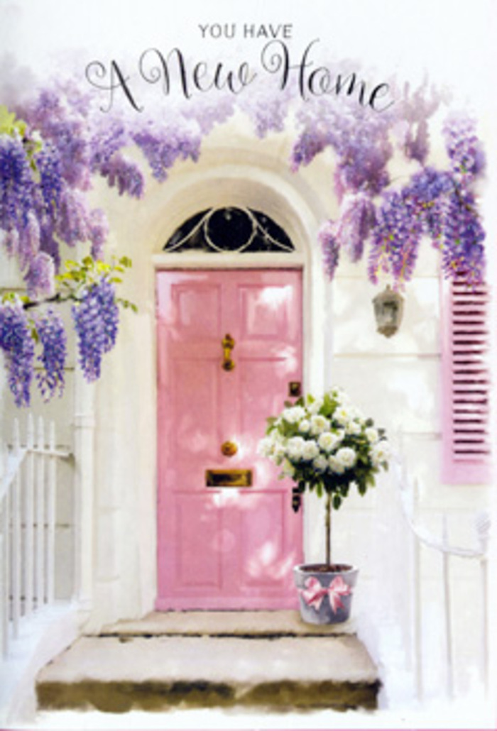 The photograph captures an entrance that could belong to a quiet mews near White City, where a painted pink door and tumbling wisteria turn a simple façade into something poetic. The front door, brushed in a delicate rose-pink hue, stands upright and serene, framed by walls that have been whitewashed to a smooth, luminous finish. This contrast of blush and white creates a fresh, uplifting mood, like the feeling of walking home on a clear evening after wandering through nearby Hammersmith Park. Above the door, wisteria vines trace their way along the wall and down the sides, sending cascades of blossoms in dusky lavender and pale violet. Each cluster of flowers hangs like a tiny chandelier, softening the lines of the doorway and lending it a dreamy, romantic air. A single shutter, painted to echo the door's pastel tones, hints at an interior filled with similar gentle touches. On the doorstep, a robust grey metal bucket acts as an impromptu vessel, overflowing with white and cream roses. The roses are tightly packed yet individually distinct, their petals rounded and velvety, suggesting that they were chosen and placed with real care. Sprigs of fresh green foliage weave between the blooms, adding depth and a sense of garden freshness. A pink satin ribbon wraps the bucket at its base, tied in a bow that mirrors both the pink door and the nearby wisteria tones. The overall composition feels relaxed yet refined, an ideal visual for a housewarming gesture in White City-capturing the quiet excitement of turning that painted door handle and stepping into a new space, already warmed by flowers and thoughtfulness.